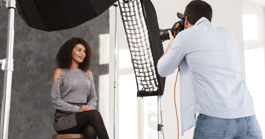 photographer taking photo of model