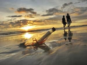 Message in a bottle with a portrait photography model in the background.