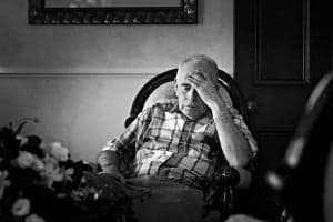 Old man sitting on a chair