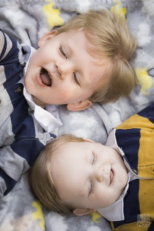 These boys wouldn't cooperate for a lying-down-together photo. About thirty minutes in, we took a break and managed to get a few while the older brother ate some gummy bears. If I didn't tell you, you'd never know there was a gummy bear in his mouth!