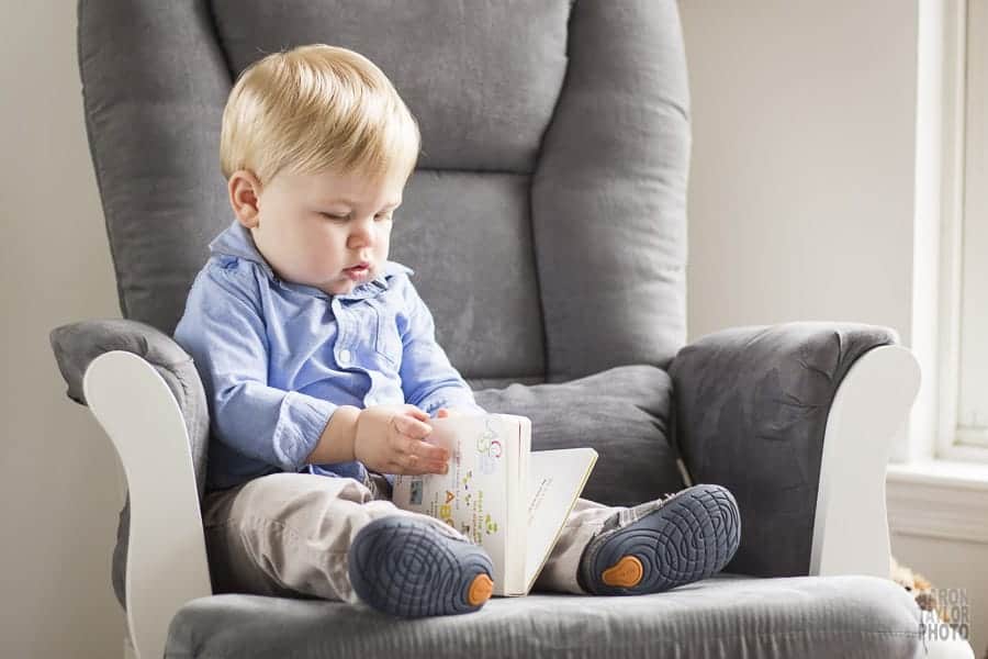 This photo was taken in this little guy's bedroom. He's reading one of his favorite books in the chair he and his parents read in each day.